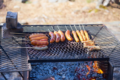 High angle view of meat on barbecue grill