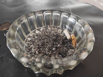 High angle view of cigarette in container