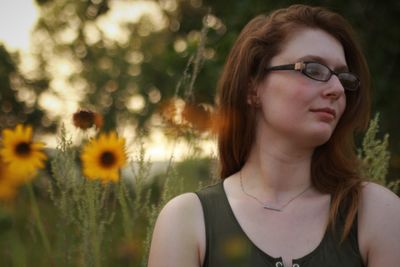 Close-up portrait of a young woman looking away