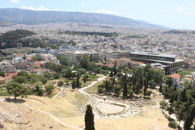 Cityscape with mountain range in background