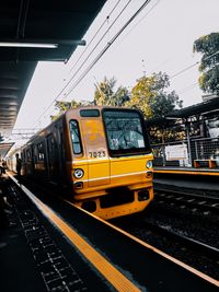 Train on railroad station platform against sky