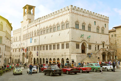 Cars on street amidst buildings in city