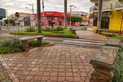 Footpath by street in city