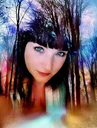 Young woman on tree trunk