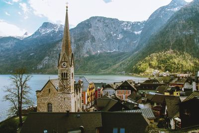 Panoramic view of buildings and mountains against sky