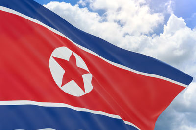 Low angle view of flag against sky