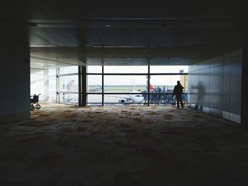 Rear view of people walking in corridor