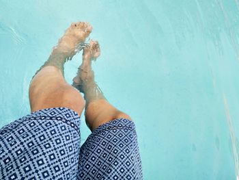 Low section of man in swimming pool