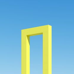 Yellow shape door building with shadows on sky background. minimal architecture ideas concept. 