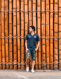 Full length of a young man looking up