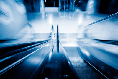 Blurred motion of illuminated escalator