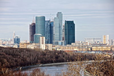 Buildings in city against sky