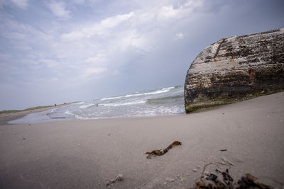 Surface level of beach against sky