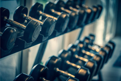 Close-up of dumbbells on rack