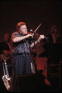 Young woman playing at music concert