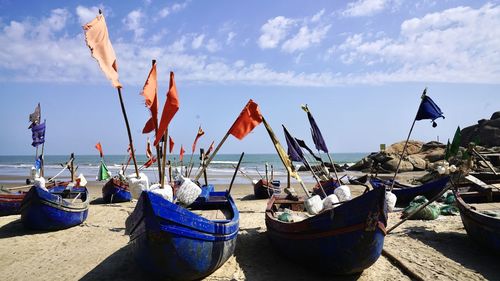 Boats moored on beach against sky vietnam 