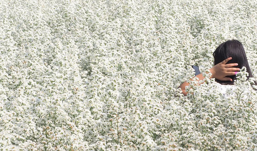 Portrait of woman on flowering plants