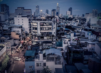 High angle view of buildings in city against sky