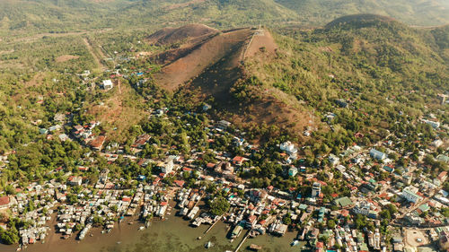 High angle view of townscape by lake