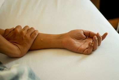 High angle view of woman massaging customer at spa