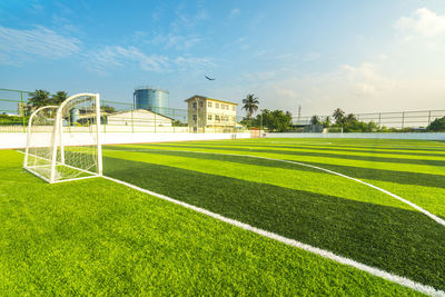 Scenic view of soccer field against sky