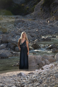 Woman standing on rock