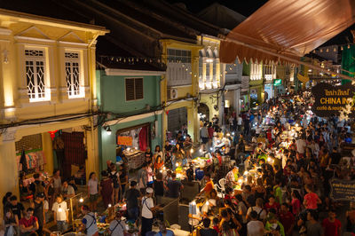 People on street market in city