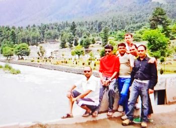 Rear view of people enjoying at park