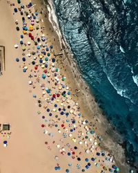 High angle view of multi colored umbrellas on beach