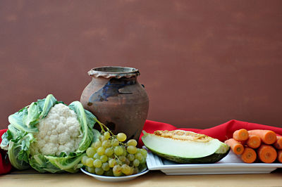 Close-up of fruits in jar on table