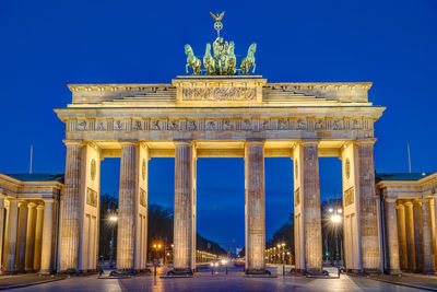 The famous brandenburg gate in berlin at dawn