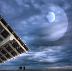 Low angle view of building against cloudy sky