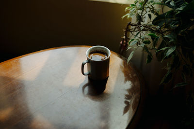 High angle view of coffee cup on table