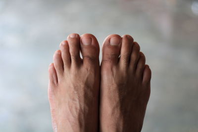 Close-up of human hand against blurred background