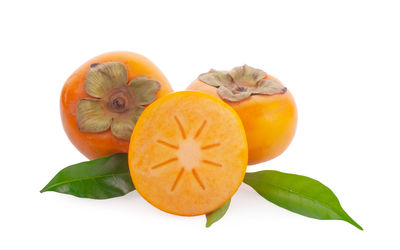 Close-up of pumpkin against orange background
