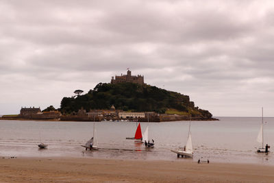 Scenic view of sea against cloudy sky