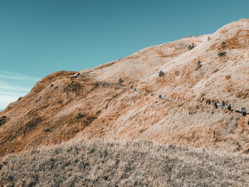 Low angle view of rock formations against sky