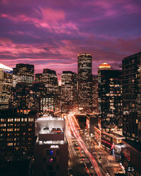 High angle view of illuminated city buildings at night