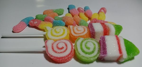 High angle view of multi colored candies on table