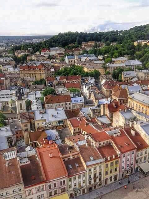 building exterior, architecture, built structure, cityscape, high angle view, city, crowded, residential district, residential structure, residential building, sky, townscape, town, roof, cloud - sky, house, day, aerial view, city life, outdoors