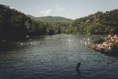 Scenic view of lake with mountains in background