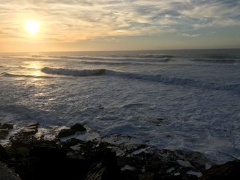 Scenic view of sea against sky during sunset