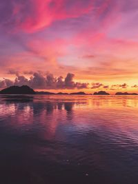 Scenic view of sea against romantic sky at sunset