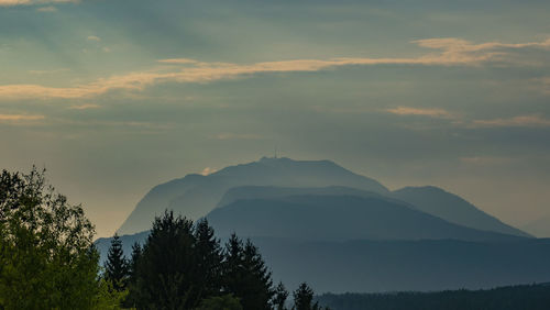 Scenic view of silhouette mountains against sky at sunset