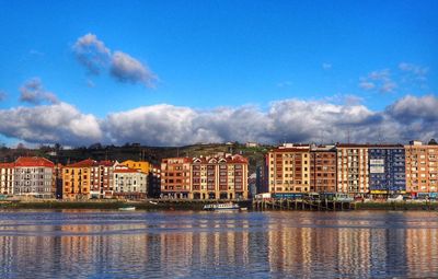 Buildings in city against sky