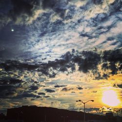 Low angle view of cloudy sky at sunset