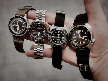 Cropped hand holding pocket watch