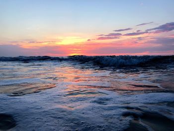 Scenic view of sea against sky at sunset