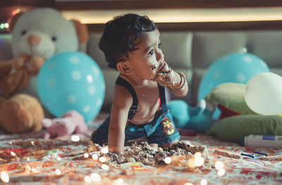 Boy playing with toy at home