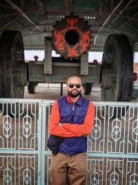 Full length of man standing against wall